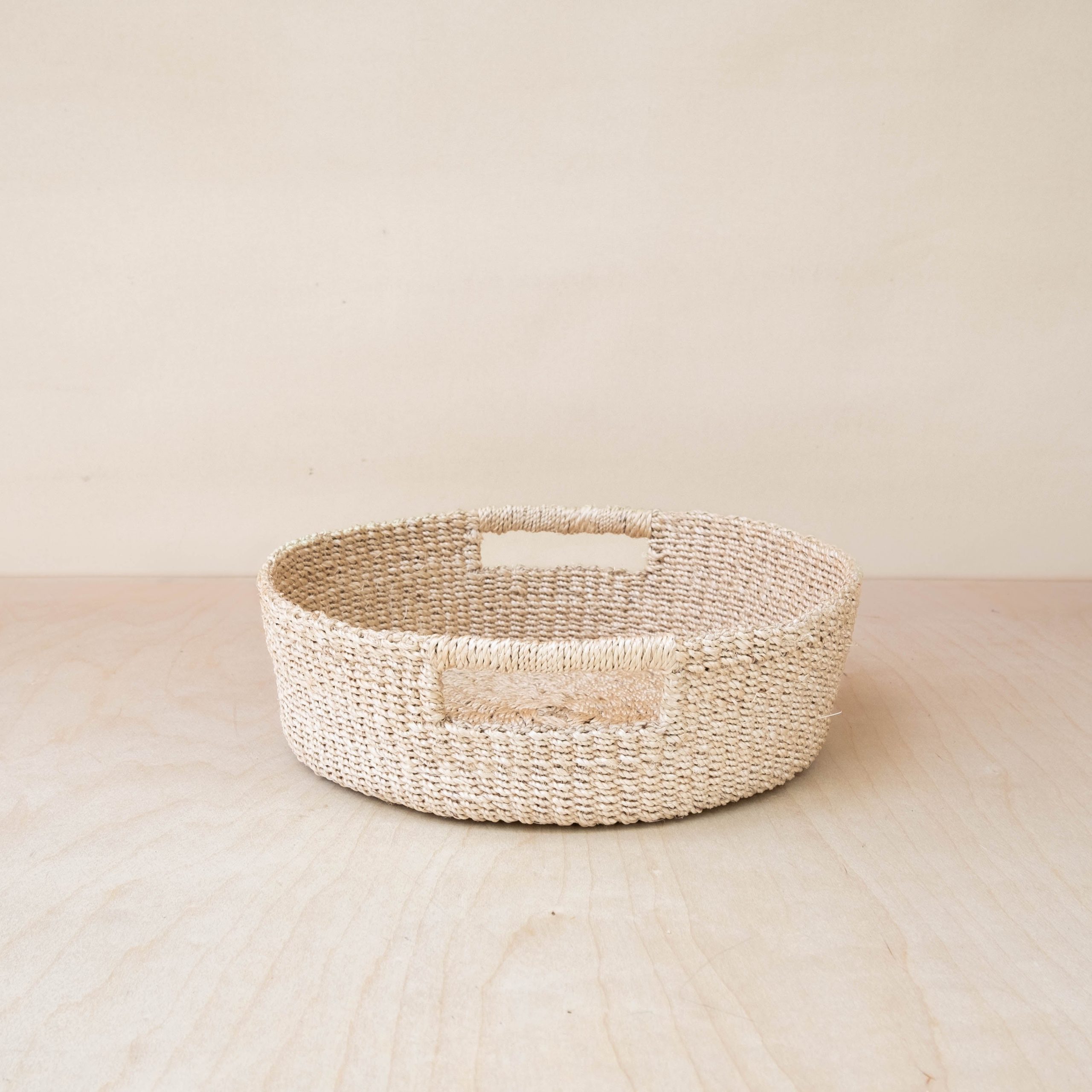 LIKHA_80117_Abaca-Round-Tray-with-Cutout-Handles-3.jpg