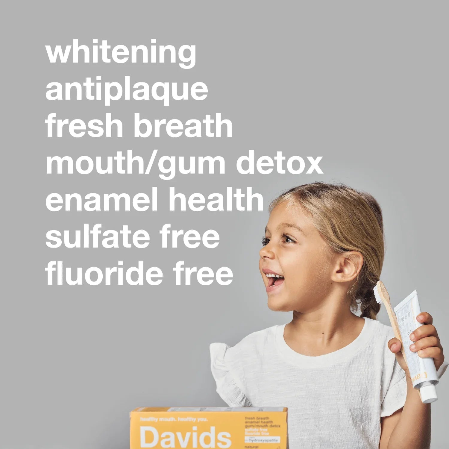 child-holding-davids-toothpaste-with-benefit-list.jpg